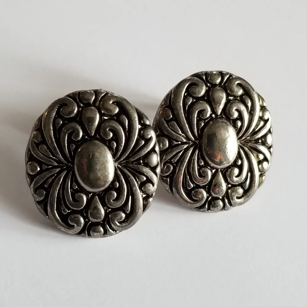 Earrings Silver tone earrings oval stud scrolled design
